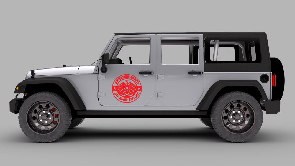Silver Jeep Wrangler JK side view with red “Adventure Awaits” off-road badge door decal