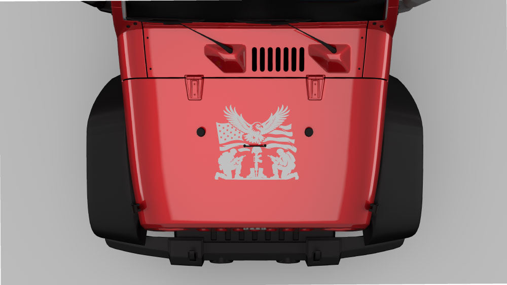 Gray Jeep Wrangler JK hood featuring Eagle of Remembrance hood decal with flying eagle, American flag, and kneeling soldiers memorial design.