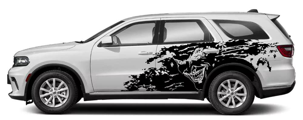 Gray Dodge Durango side view featuring white Joker splash grunge side decal kit on rear passenger-side panels.