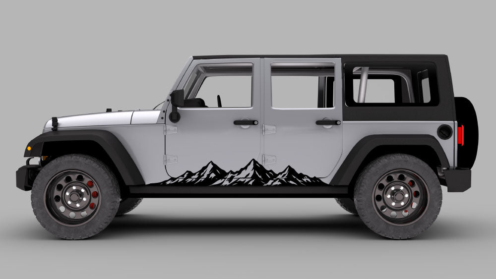 Gray Jeep Wrangler JK with Mountain Range rocker panel side decal in white along the lower doors.