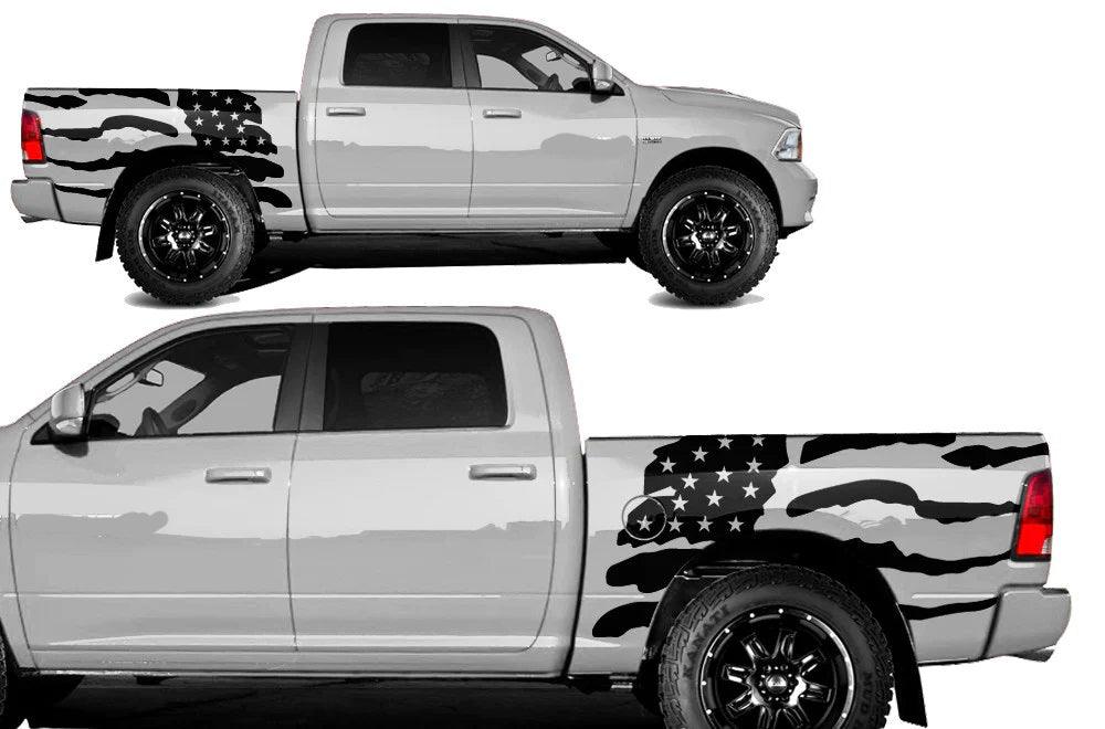Distressed American flag vinyl bed decal installed on the rear bed side of a 2009–2018 Dodge Ram 1500 pickup truck, featuring bold monochrome stars and waving stripes.
