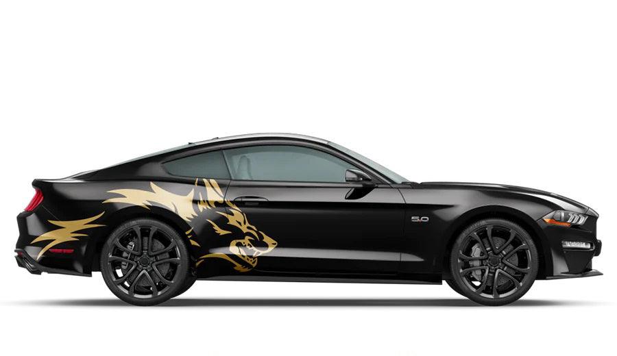 Gold coyote head Mustang side vinyl graphics kit on black GT coupe near rear wheel