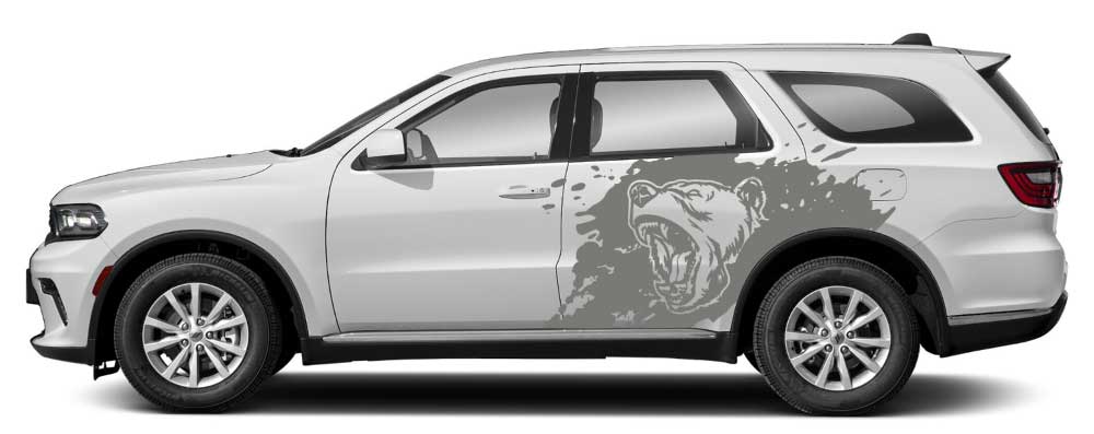 White Dodge Durango with gray roaring bear splash side decal graphic on rear door and quarter panel.