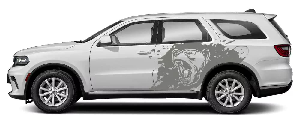 White Dodge Durango with gray roaring bear splash side decal graphic on rear door and quarter panel.
