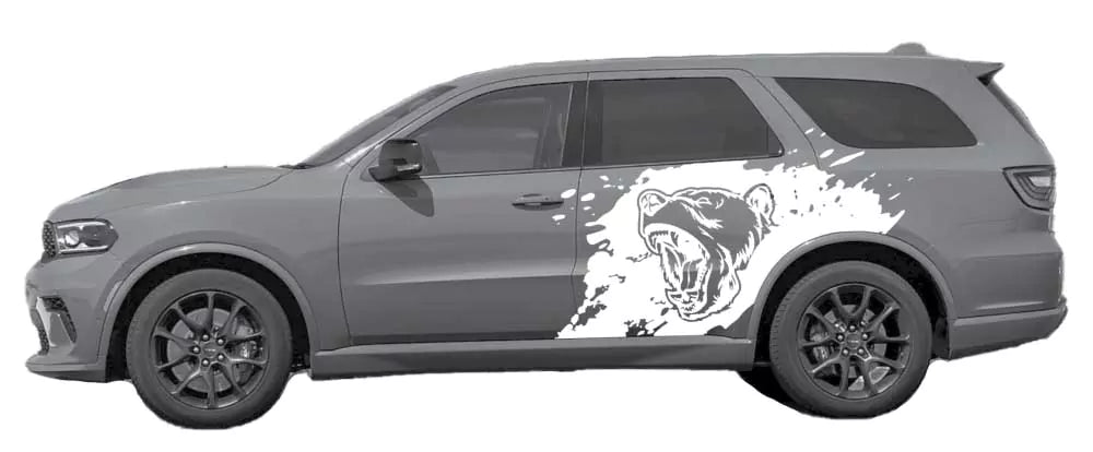 Gray Dodge Durango with white roaring bear splash side decal graphic on rear door and quarter panel.