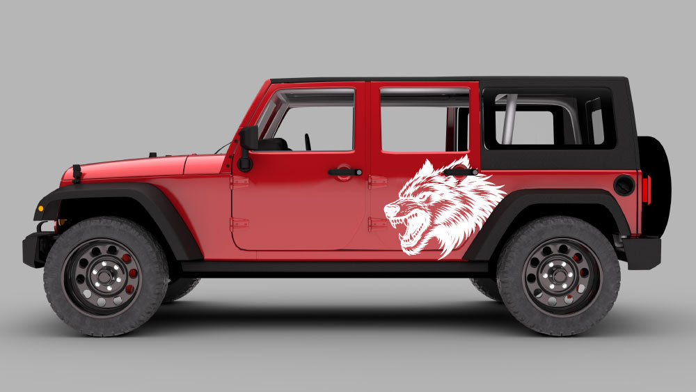 Red Jeep Wrangler JK 4-door with white howling wolf head side door decal on rear door