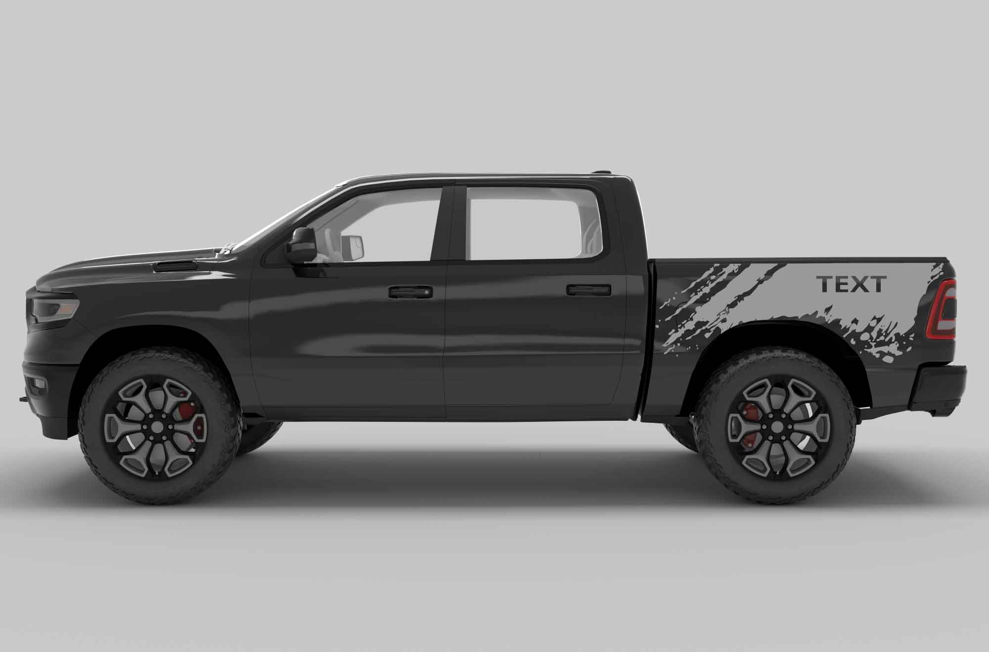 Side view of a black dodge ram  pickup truck with custom text decals on the side bed in gray color